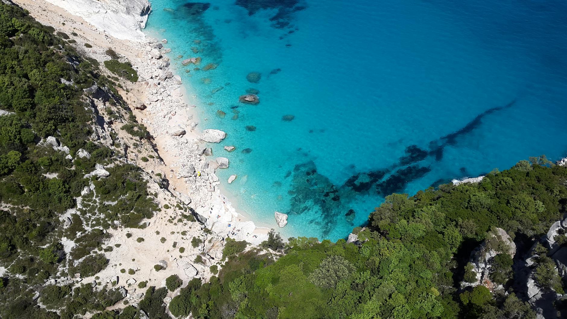 Travel bucket list, aerial photography of sea water and cliff, Sardinia Italy - Photo by Pixabay on Pexels.com
