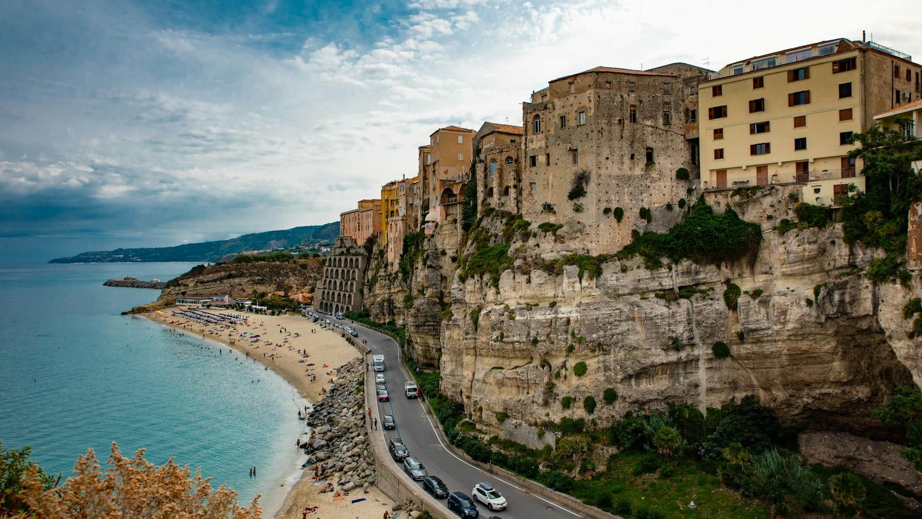 Travel bucket list, view of an old coastal town with buildings on a cliff, Calabria Italy - Photo by Francesco  Altamura on Pexels.com