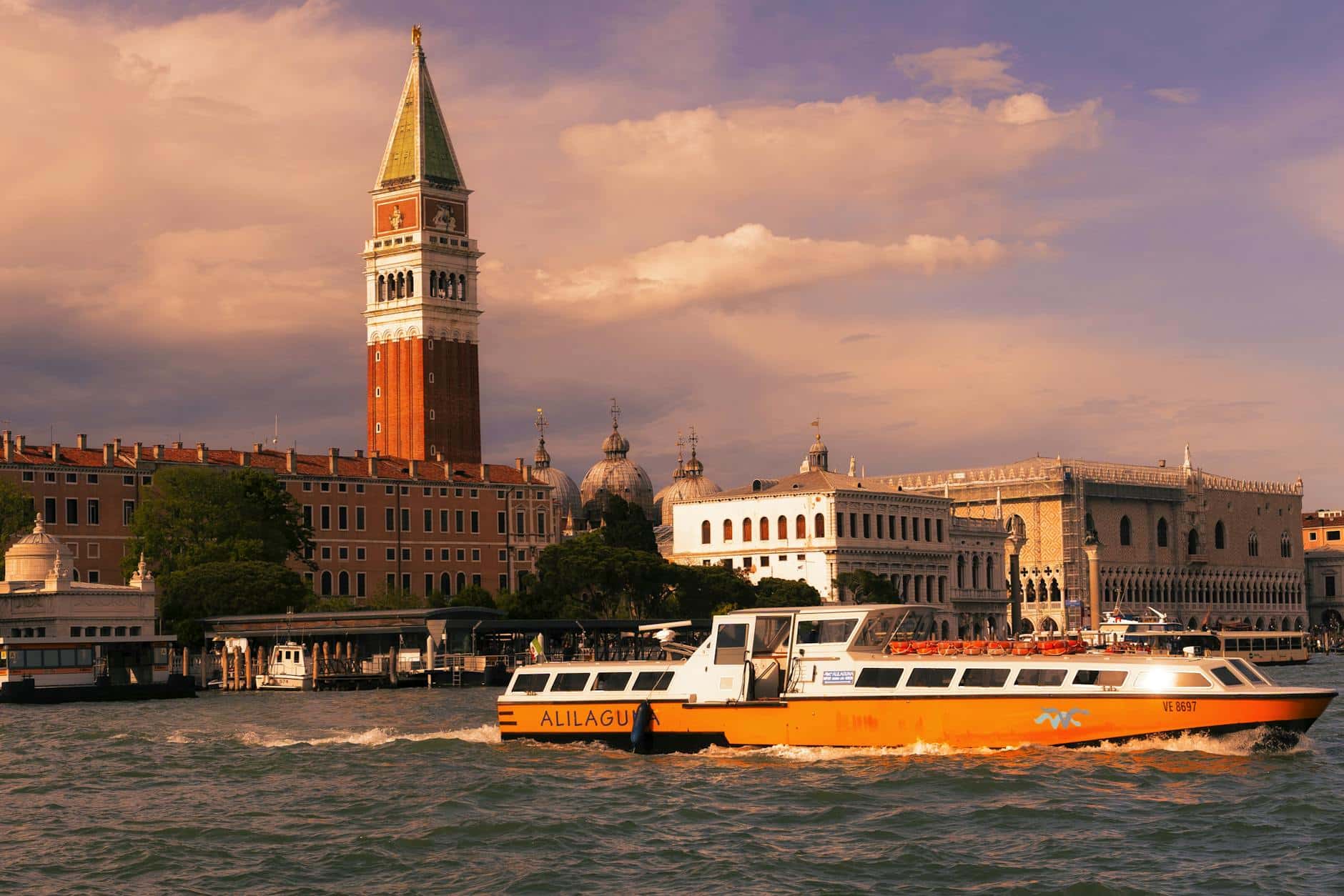 Campanile and vaporetto at st. Mark's square - Photo by Cătălin Todosia on Pexels.com