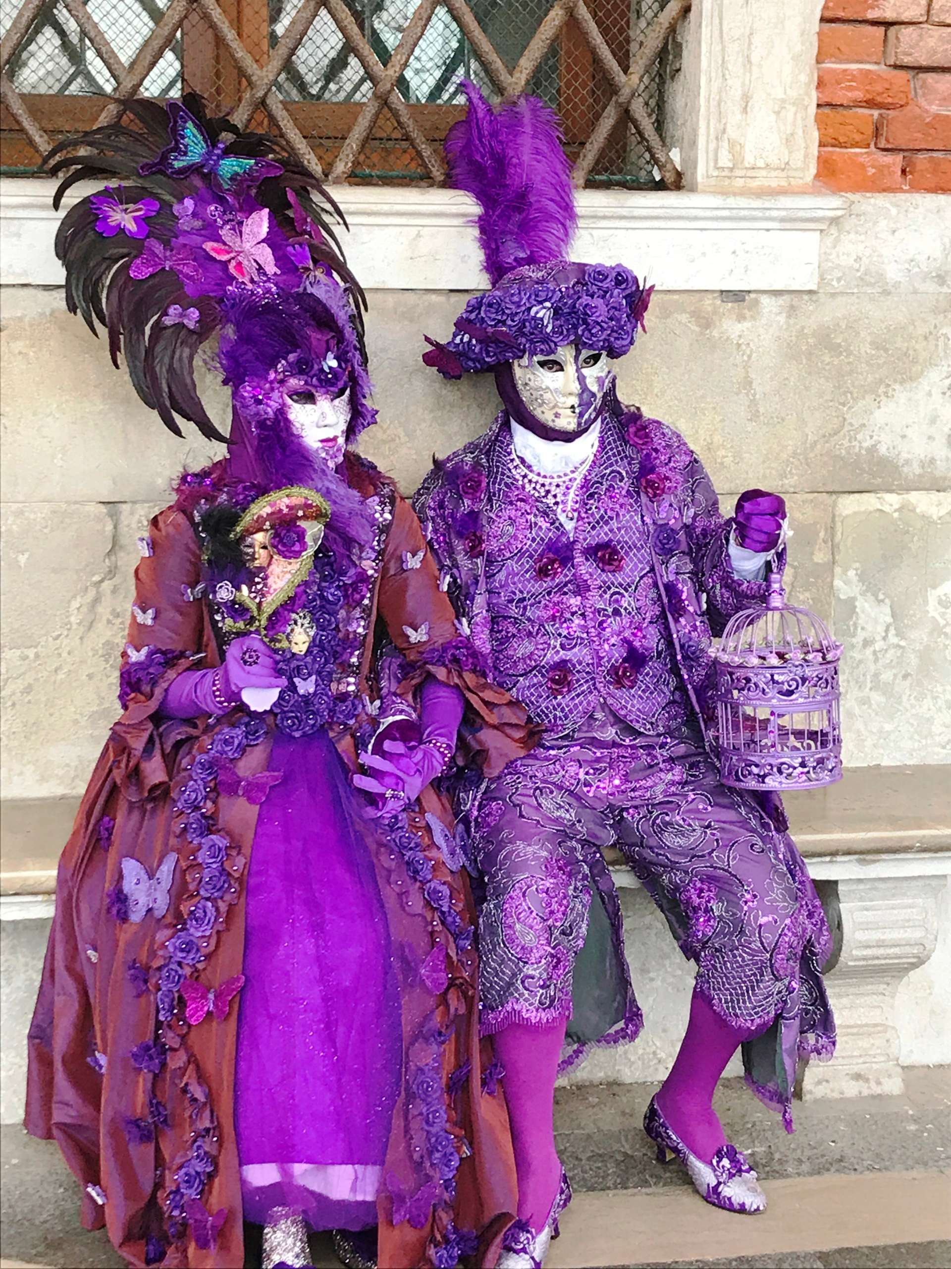 Purple marked costumes Venice Carnival Italy