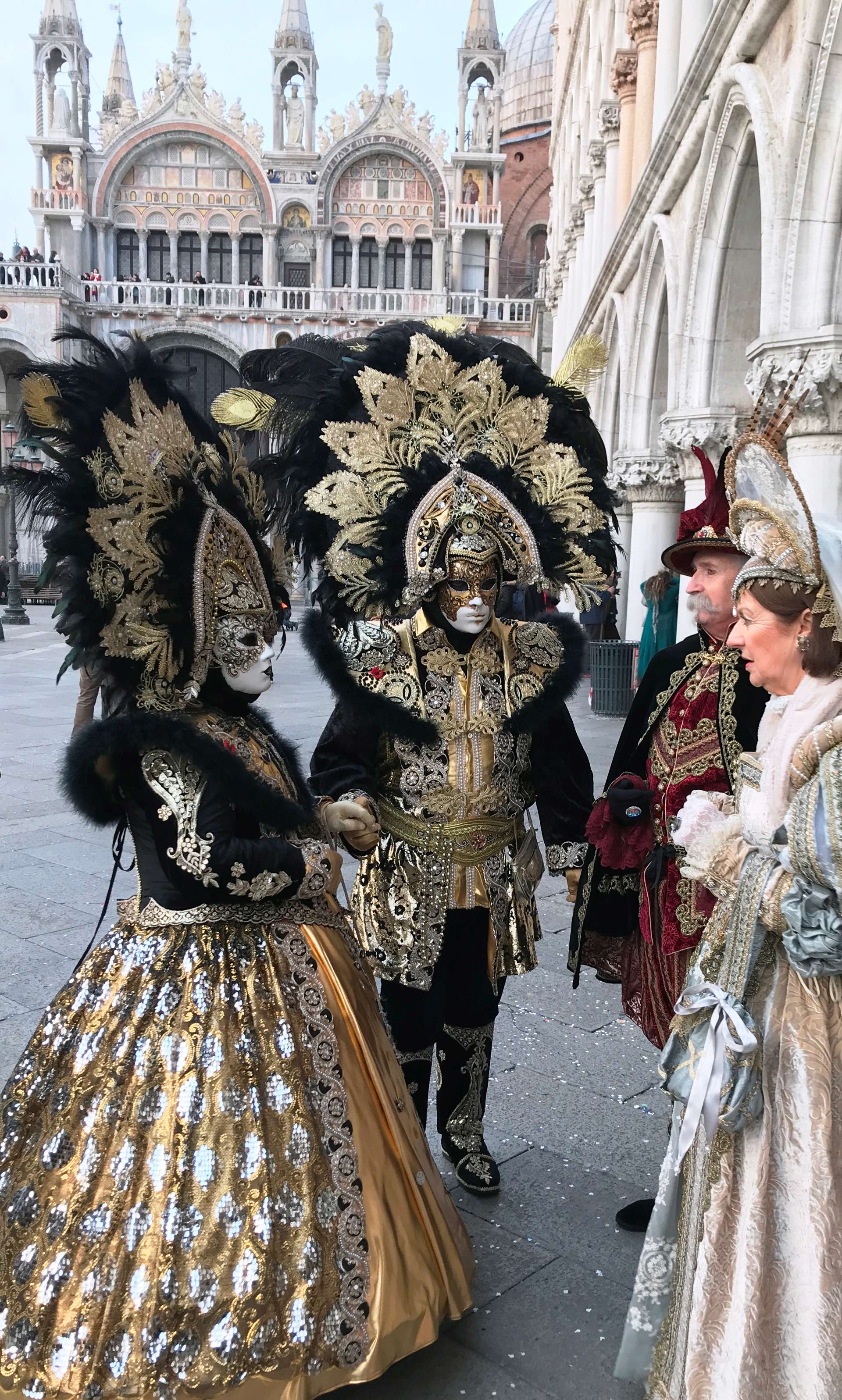 Venice Carnival -costumed people in St. Mark's