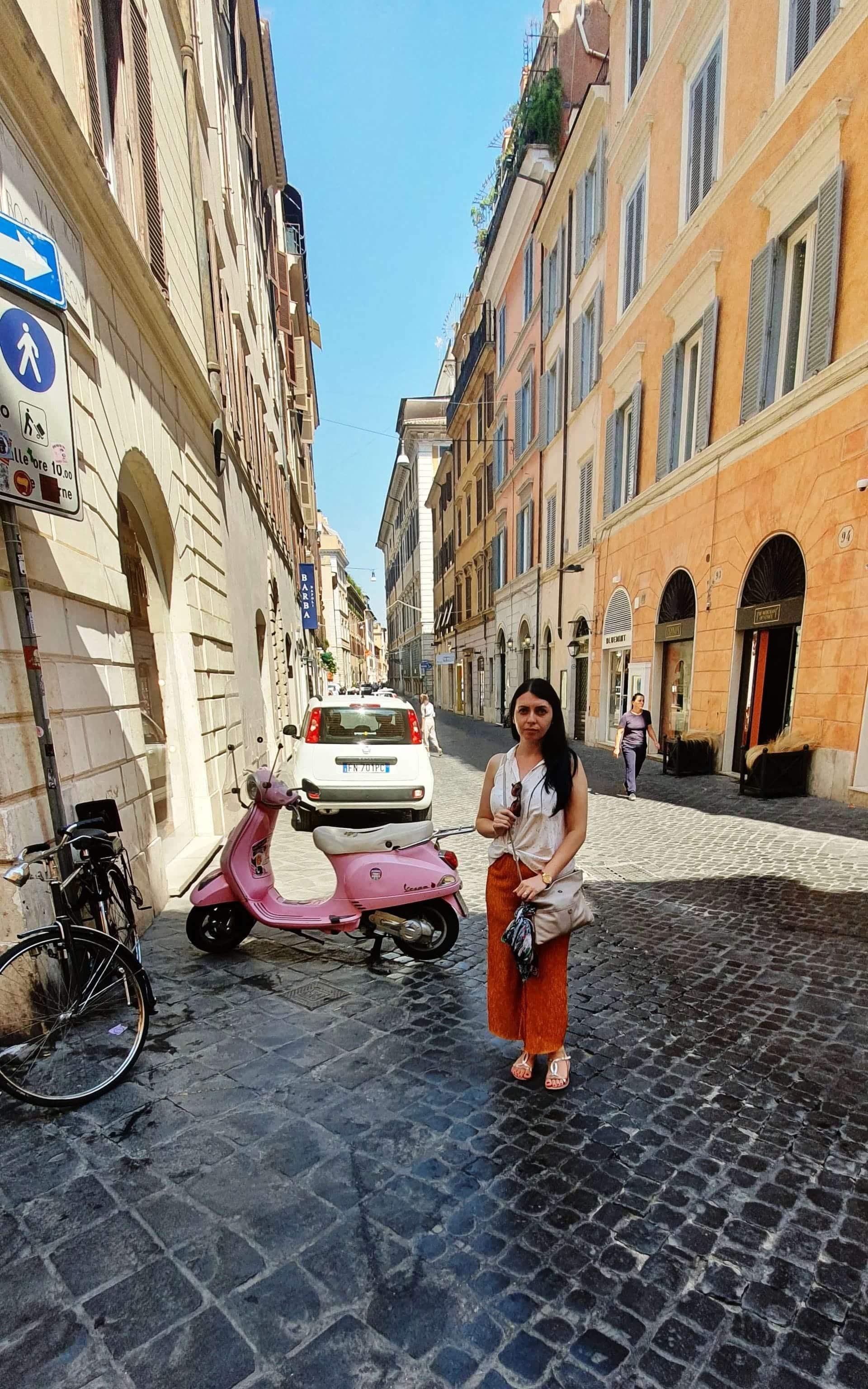 Pink Vespa Pink Vespa, on the shopping streets of Rome, near the Spanish Steps, heading to the Pantheon